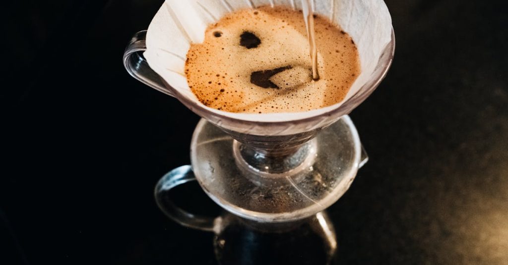 Top view of a pour-over coffee brewing process using a filter dripper set. how to make good coffee at home