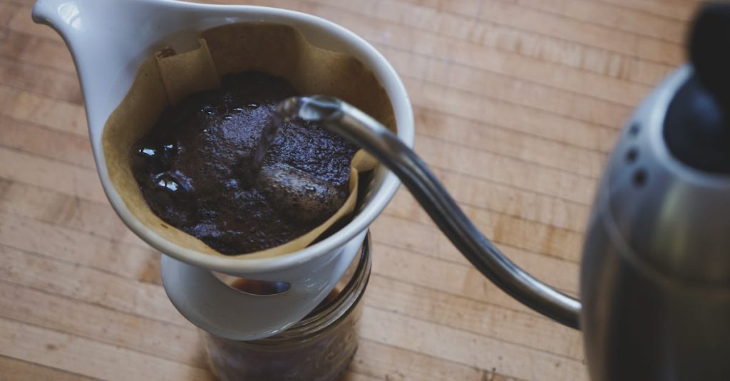 Close-up of freshly brewed pour over coffee on a wooden countertop. how to brew coffee